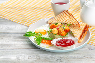 Club sandwich panini with ham, tomato, cheese and basil with cheese balls