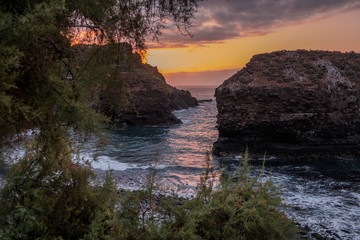 Bautiful sunset on Tenerife, with waves and stones