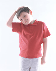 portrait of a cheerful boy in a red t-shirt.isolated on white background