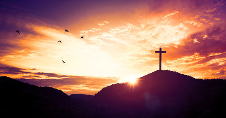 Christmas concept: Crucifixion Of Jesus Christ Cross At Sunset