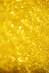 Glitter defocused abstract background with blurry lights, stars. Christmas festive texture. New year party