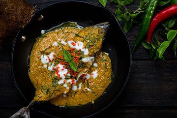 Fried fish with curry paste NO.003. Intense flavor delicious fried fish with crispy topped with spicy red curry.