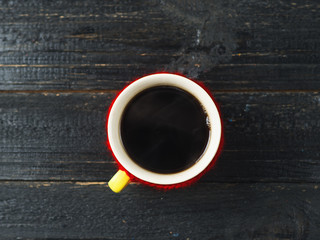 coffee mug on dark wooden table top view