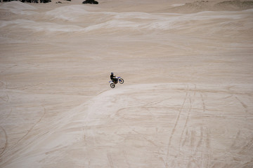 Guy running on the motorbike
