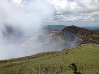 Smoking Masaya volcano crater and cross at Masaya National Park - Nicaragua