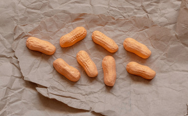 Circus peanut candies on brown paper.