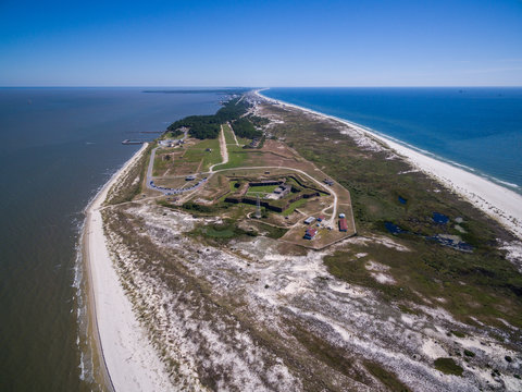 Drone/Aerial photograph of Fort Morgan.  A Civil War fort located at the end of the Gulf Shores peninsula, the entrance to Mobile Bay.  Alabama, USA