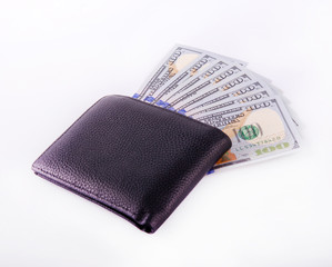 Money background, US dollars, a wallet and US dollars bills isolated over white background