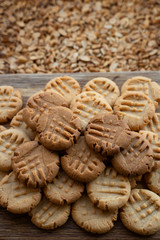 Fototapeta na wymiar Freshly baked peanut butter cookies on cooling rack. Macro with extremely shallow dof