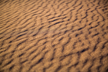 fantastic texture with shadows in the sand desert