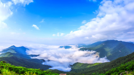 Fototapeta na wymiar Beautiful view above the clouds on the mountains from the aerial view