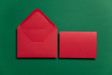 Blank red card with red paper envelope Christmas card template mock up.