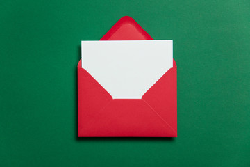 Blank white card with red paper envelope Christmas card template mock up. - Powered by Adobe