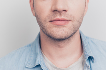 Fototapeta premium Cropped close up portrait of gentleman face isolated on light gr