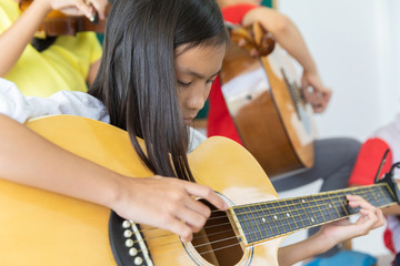 asia students in the music school
