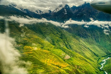 Clouds cap the vibrant Nepali landscape