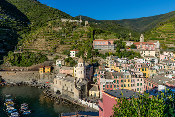 Fototapeta na wymiar Beautiful aerial view of the center of Vernazza illuminated by the late afternoon sun, Cinque Terre, Liguria, Italy