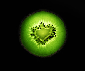 macro photography of a cutted half kiwi with light effects