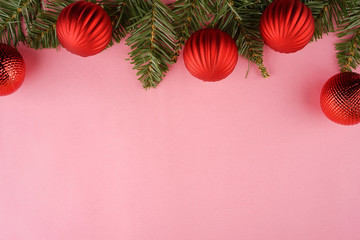 Merry Christmas. Christmas ornaments creatively arranged across the frame. Seasons greetings. Flat lay or top view.