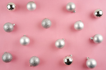Merry Christmas. Christmas ornaments creatively arranged across the frame. Seasons greetings. Flat lay or top view.