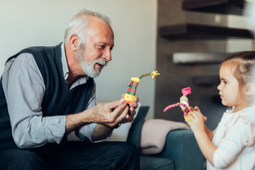 Showing new toys to my grandpa © bernardbodo