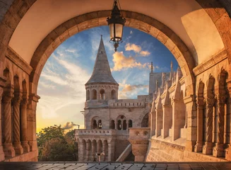 Foto auf Acrylglas Budapest Sunrise viewed through the arches of the Fisherman's Bastion in Budapest, Hungary