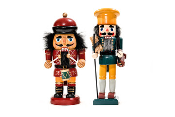 Merry Christmas: Two traditional colorful vintage wooden nutcracker puppets in uniform isolated on...
