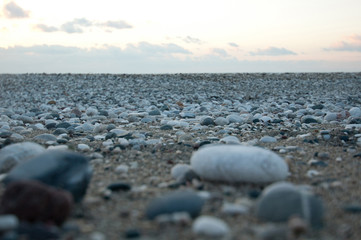 Pebbles on the sea beach shot at sunrise
