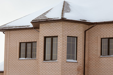 Country house cottage in the snow in winter