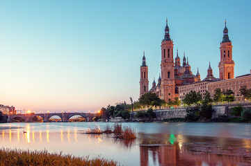Beautiful sunrise landscape in Zaragoza. Spain. Aragon.  Basilica of Our Lady of the Pillar in Zaragoza and Ebro River.
