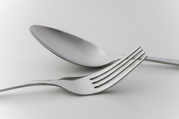 cutlery fork and spoon over white background