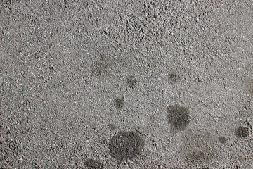 Street asphalt surface texture with oil stains