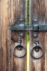 Closeup of a metal latch on a wooden gate Olde-worlde