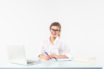 beautiful business woman smile sitting at the desk working using laptop looking at screen, hand writing, isolated over white background