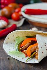 Mexican vegetarian food - fajitas wrapped on tortilla bread.