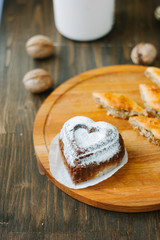 Cake in form of heart as symbol of love.
