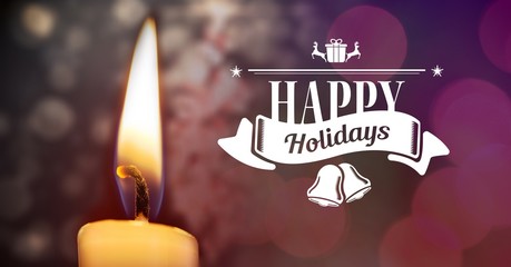 Happy holidays text with candle