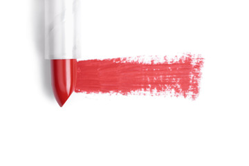top view of red lipstick stroke on white backdrop