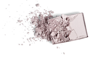 top view of cracked grey eyeshadow on white backdrop