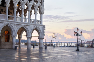 Saint Mark square in Venice with pink sky and lagoon in the early morning, Italy
