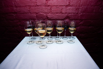 Many glasses of wine in a luxurious, stylish atmosphere. Social welcome, new year, wedding, party