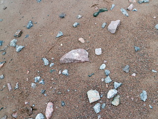 granite stones on the sand by the sea