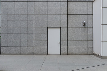 sidewalk by street wall & door