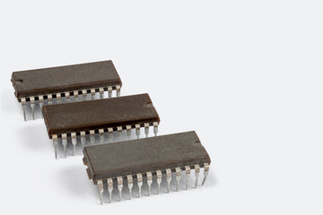 Very old computer chip isolated on a white background.