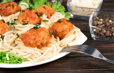 Spaghetti bolognese pasta with tomato sauce, vegetables and minced meat - homemade healthy Italian pasta on a rustic wooden background.