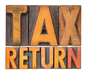 tax return word abstract in wood type