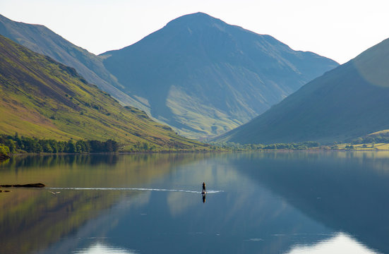 Person on paddle board, enjoying the solitude on wastwater, the lake district cumbria, 