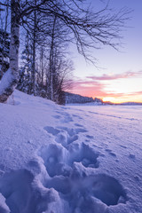 Winter season landscape with footpath and sunset