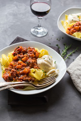 Pappardelle pasta with meat ragout and burrata cheese