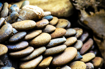 Fototapeta na wymiar A pile of round pebble stones